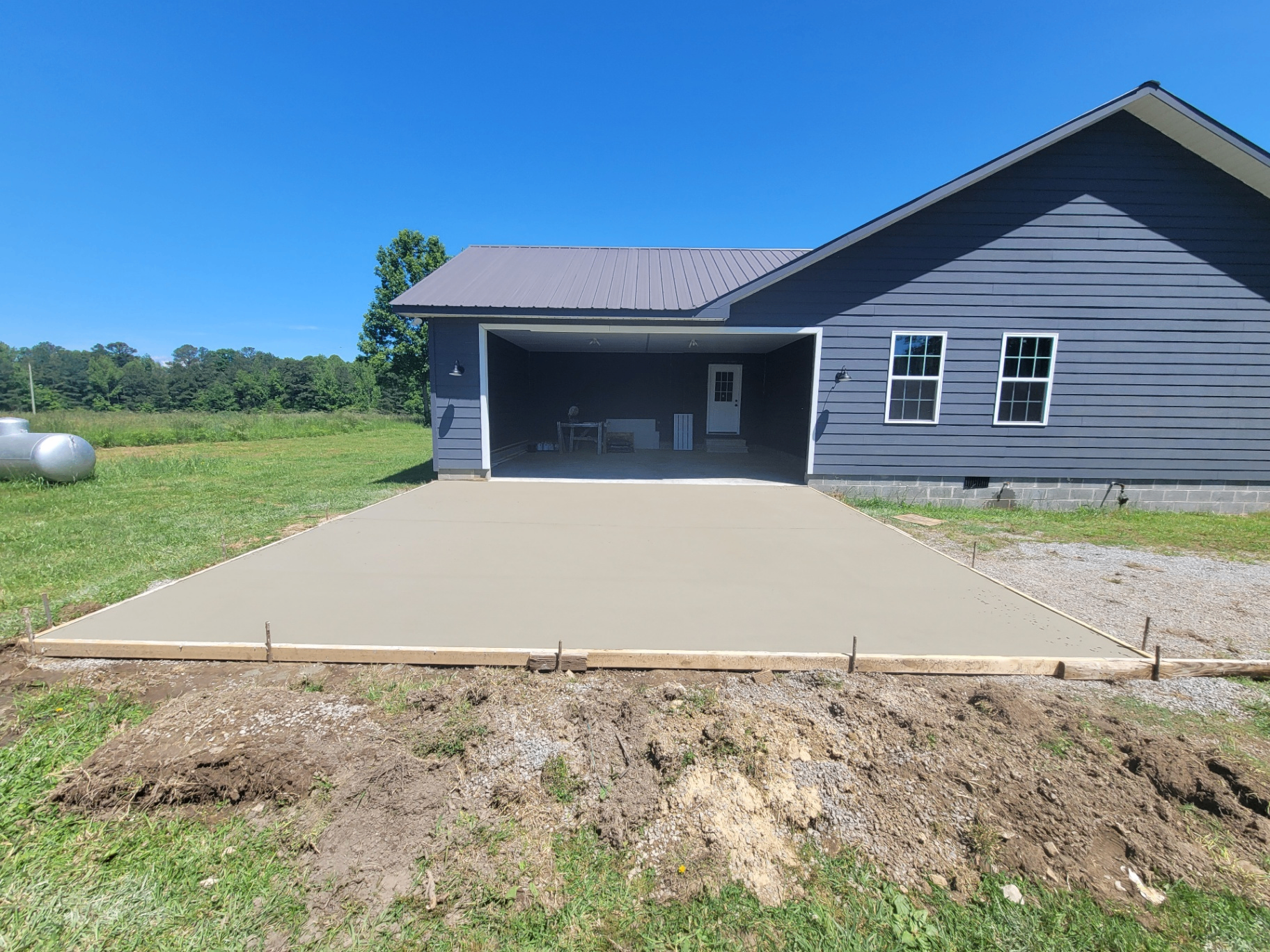 Professional concrete contractor pouring large garage slab in Jackson County